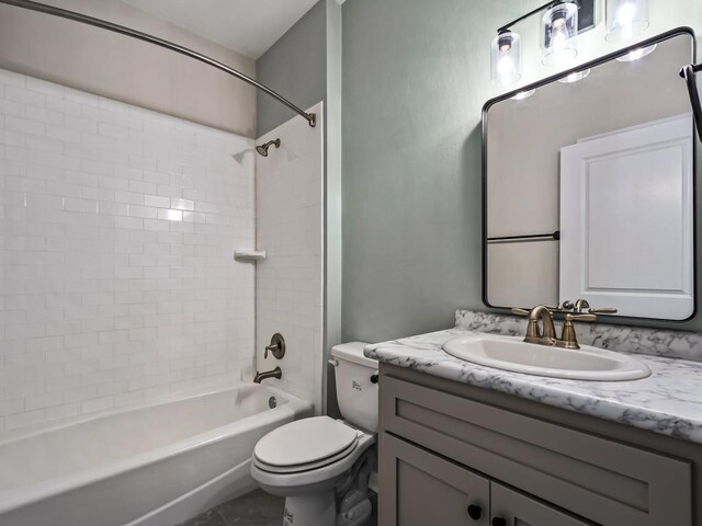 bathroom with vanity, toilet, and bathing tub / shower combination