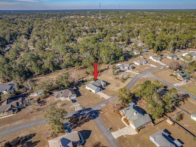 aerial view featuring a residential view and a view of trees