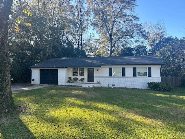 single story home with a garage and a front lawn