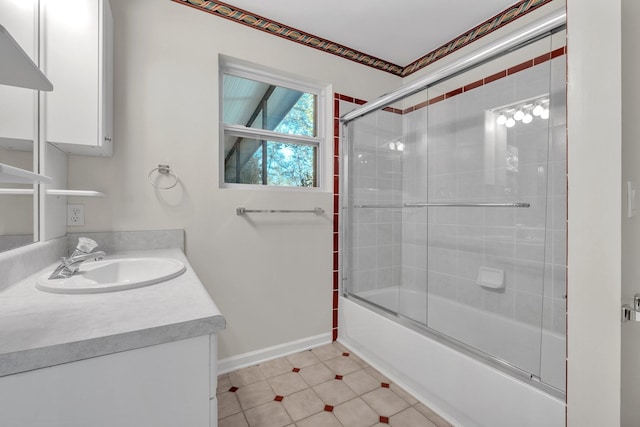 bathroom featuring shower / bath combination with glass door and vanity