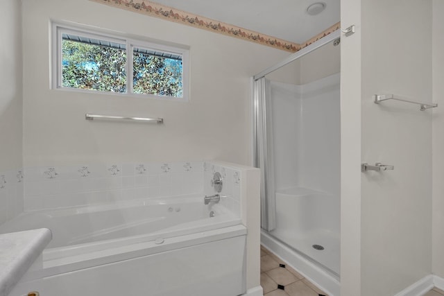 bathroom featuring independent shower and bath and tile patterned flooring