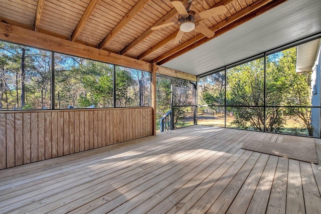 unfurnished sunroom with ceiling fan, beam ceiling, and wood ceiling