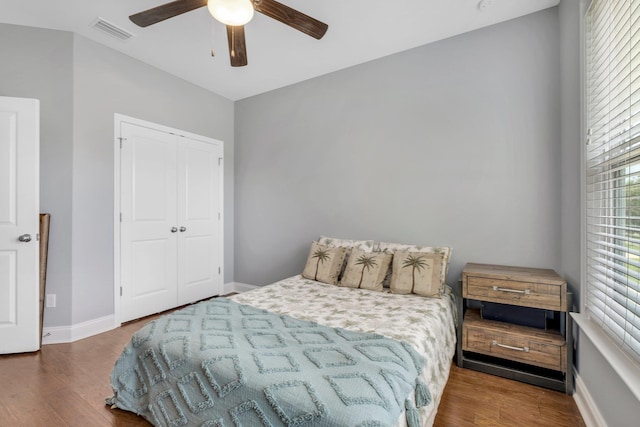 3260 Coneflower Dr, Tallahassee, FL 32311 - bedroom with wood finished floors, a closet, baseboards, and a ceiling fan