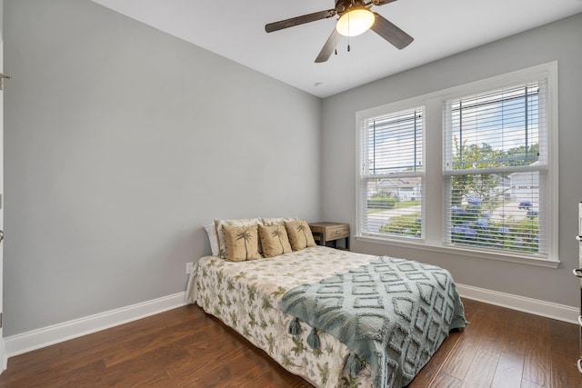 3260 Coneflower Dr, Tallahassee, FL 32311 - bedroom with baseboards, dark wood-type flooring, and ceiling fan