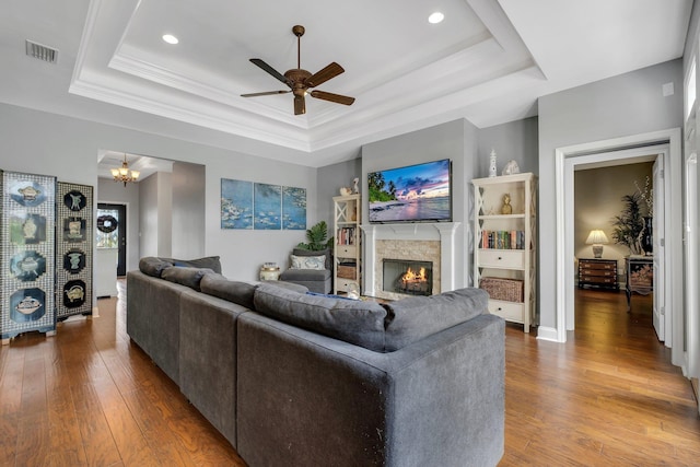 3260 Coneflower Dr, Tallahassee, FL 32311 - living room with a tray ceiling, a lit fireplace, ceiling fan, hardwood / wood-style flooring, and recessed lighting