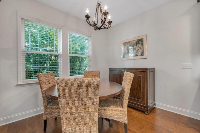 3260 Coneflower Dr, Tallahassee, FL 32311 - dining space with a chandelier, baseboards, and wood finished floors