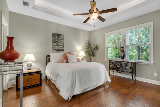 3260 Coneflower Dr, Tallahassee, FL 32311 - bedroom with a raised ceiling, wood-type flooring, baseboards, and a ceiling fan