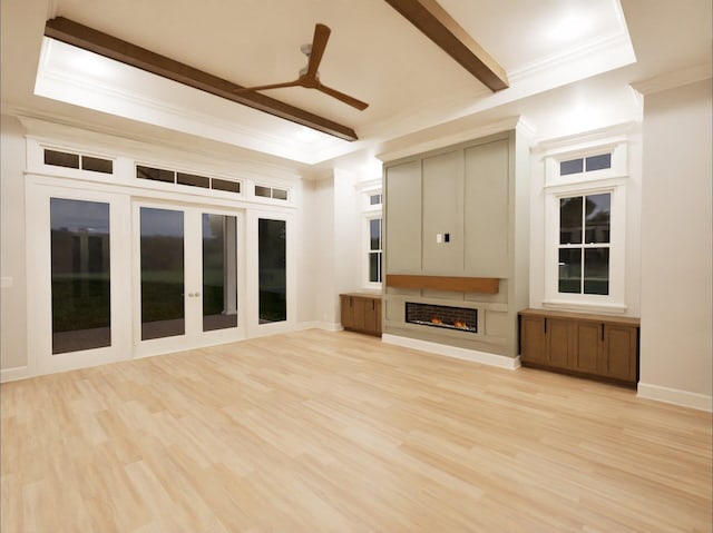 unfurnished living room with beam ceiling, light hardwood / wood-style flooring, crown molding, and ceiling fan