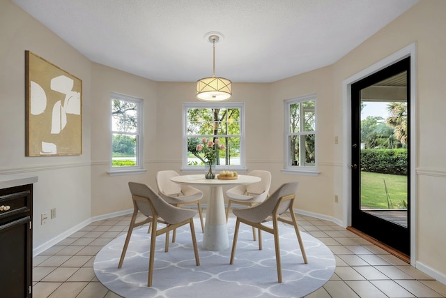6557 Alan A Dale Trl, Leon, FL 32309 - dining room with light tile patterned floors and baseboards