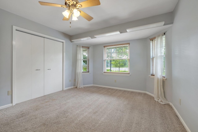 6557 Alan A Dale Trl, Leon, FL 32309 - unfurnished bedroom with carpet floors, a closet, and baseboards