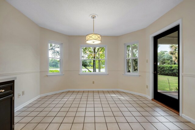 6557 Alan A Dale Trl, Leon, FL 32309 - unfurnished dining area with baseboards
