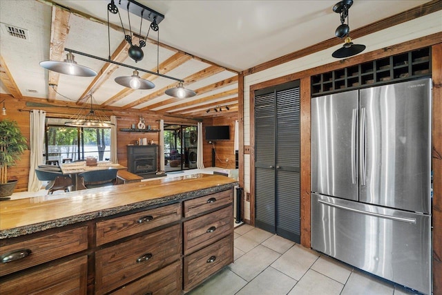 436 Tharpe Cir, Quincy, FL 32351 - kitchen with freestanding refrigerator, light tile patterned flooring, and brown cabinets