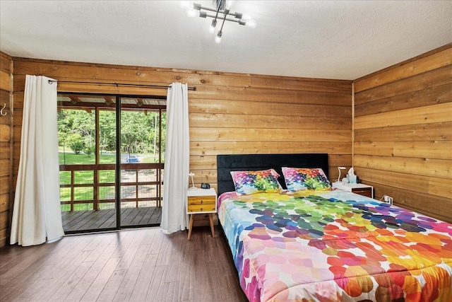 436 Tharpe Cir, Quincy, FL 32351 - bedroom with access to exterior, wooden walls, and wood finished floors