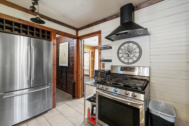 436 Tharpe Cir, Quincy, FL 32351 - kitchen with stainless steel appliances, ventilation hood, light tile patterned floors, and wood walls