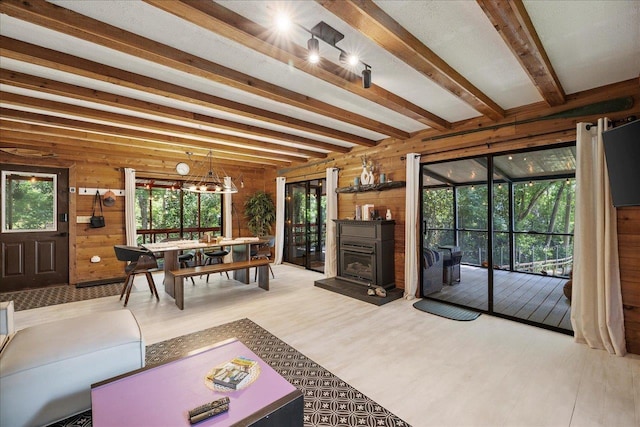 436 Tharpe Cir, Quincy, FL 32351 - living area with wood walls, wood finished floors, and beamed ceiling