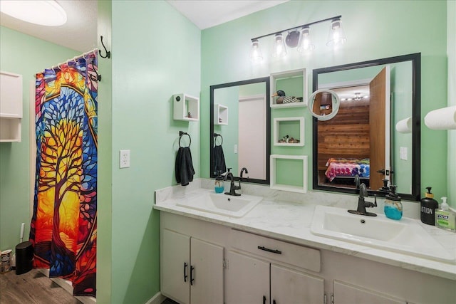 436 Tharpe Cir, Quincy, FL 32351 - bathroom featuring double vanity and wood finished floors