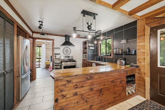 436 Tharpe Cir, Quincy, FL 32351 - kitchen with stainless steel appliances, wall chimney exhaust hood, and wooden walls
