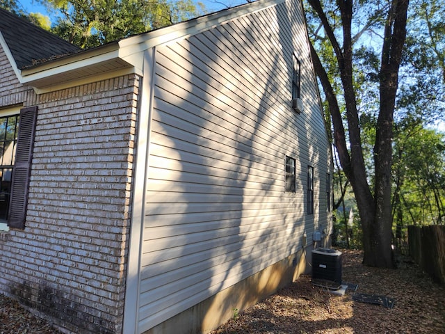 view of property exterior with central AC