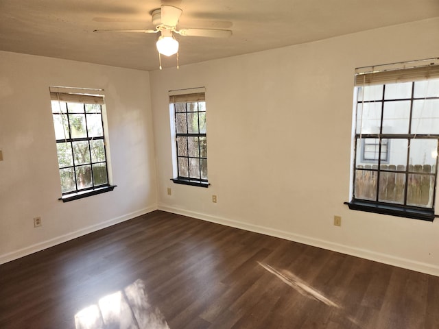 unfurnished room with dark wood-type flooring and ceiling fan