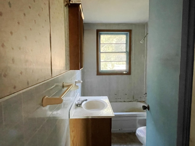 full bathroom featuring shower / tub combination, vanity, and toilet