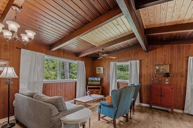 living area featuring wood ceiling, ceiling fan with notable chandelier, light hardwood / wood-style flooring, vaulted ceiling with beams, and wood walls