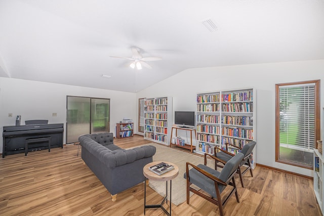 4308 Snoopy Ln, Tallahassee, FL 32303 - living area with vaulted ceiling, light wood finished floors, and a ceiling fan