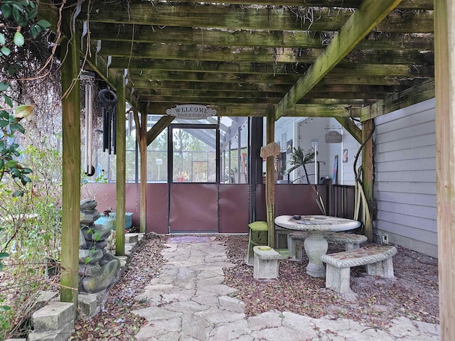 view of patio / terrace with a sunroom