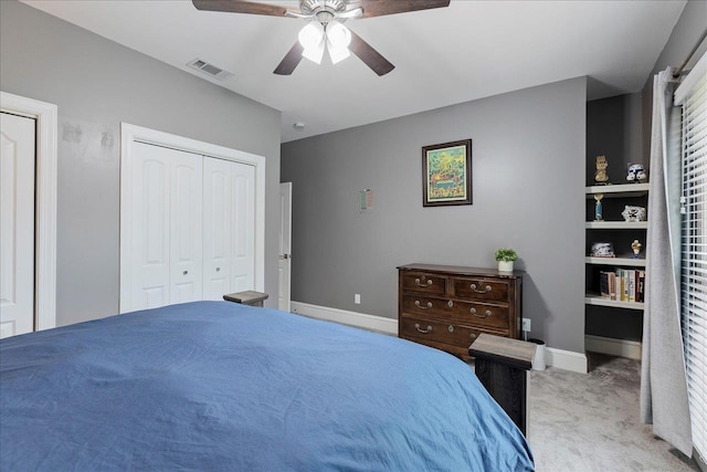 bedroom with ceiling fan and light carpet