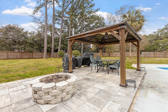 view of patio / terrace with a gazebo, area for grilling, and a fire pit