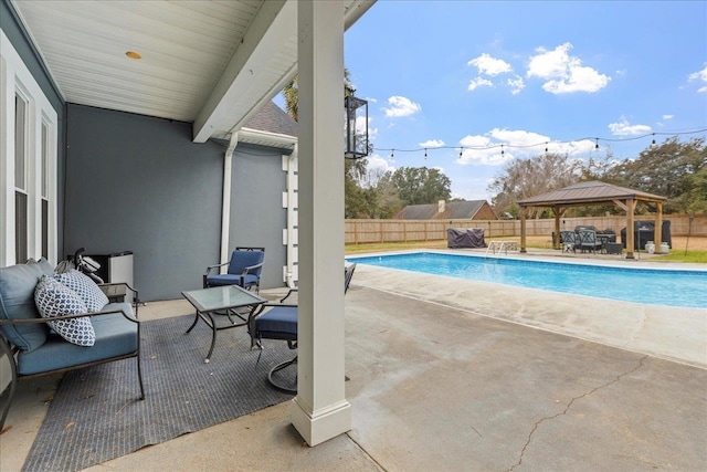 view of pool with a gazebo and a patio