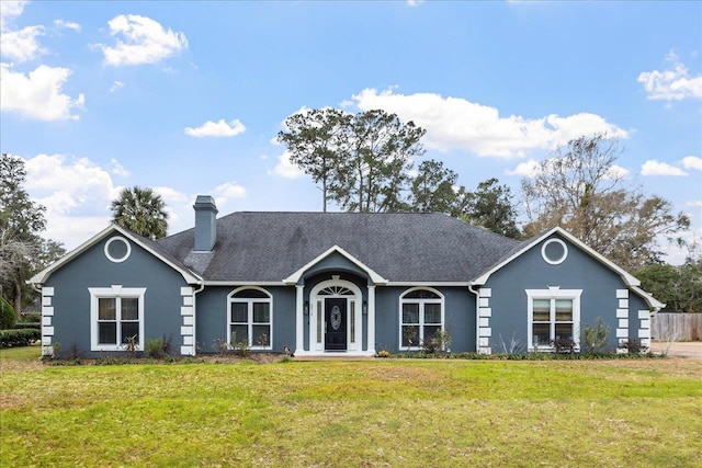 ranch-style home featuring a front yard