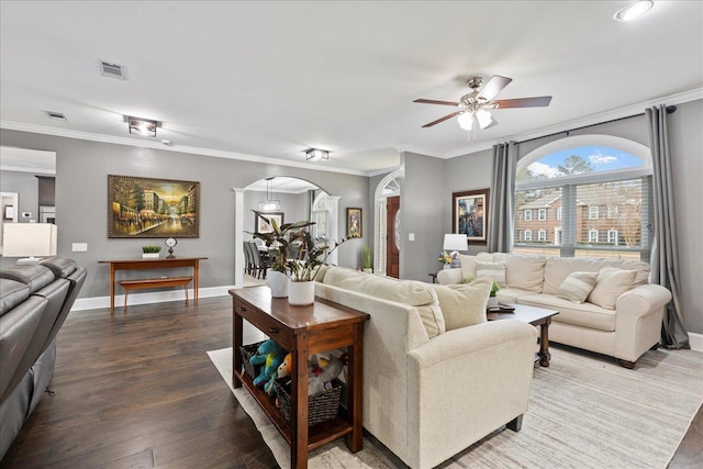 living room with crown molding, ceiling fan, and hardwood / wood-style floors