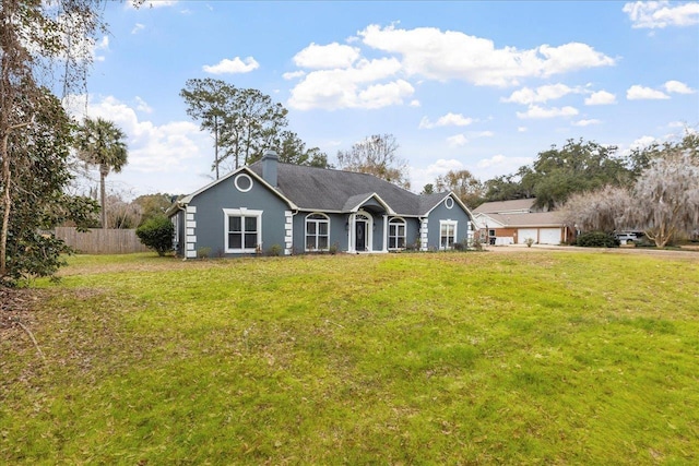 ranch-style house with a front lawn