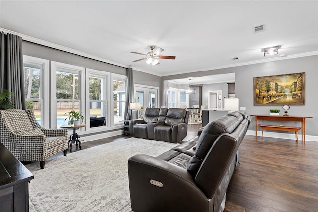 living room featuring crown molding, dark wood-type flooring, and ceiling fan