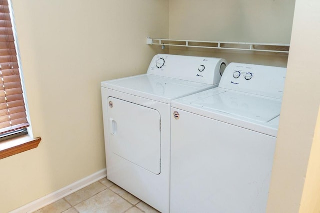 1839 Meriadoc Rd, Tallahassee, FL 32303 - laundry area featuring washer and clothes dryer and light tile patterned floors