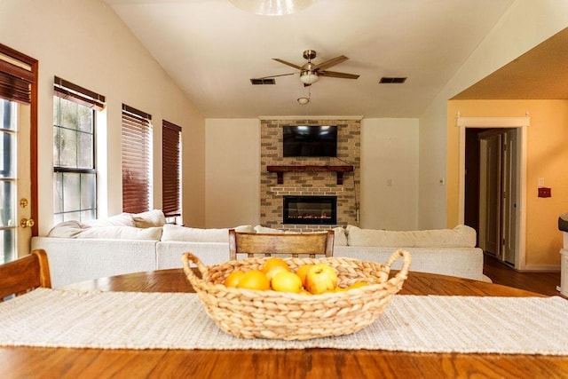1839 Meriadoc Rd, Tallahassee, FL 32303 - living room with a ceiling fan, wood finished floors, lofted ceiling, and a brick fireplace
