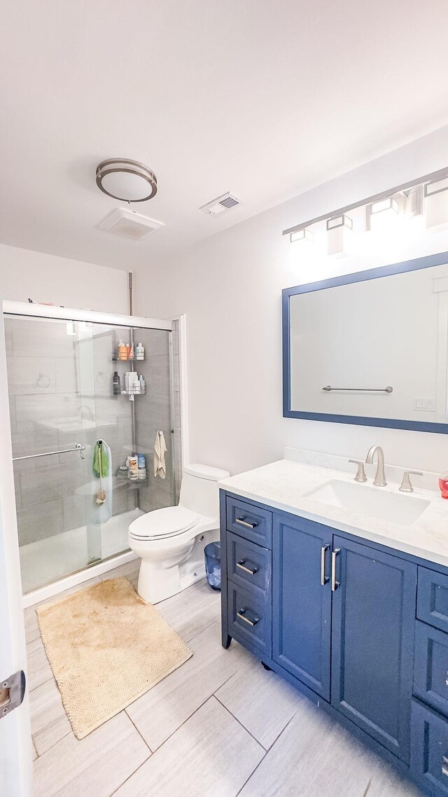 1839 Meriadoc Rd, Tallahassee, FL 32303 - bathroom with vanity, a shower stall, and wood finished floors