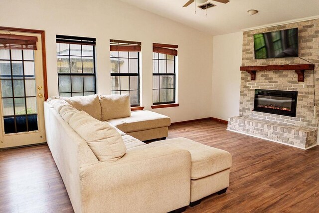 1839 Meriadoc Rd, Tallahassee, FL 32303 - living area featuring ceiling fan, wood finished floors, healthy amount of natural light, vaulted ceiling, and a brick fireplace