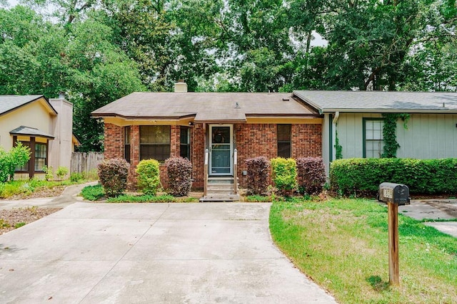 1839 Meriadoc Rd, Tallahassee, FL 32303 - ranch-style home featuring a chimney and brick siding