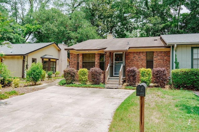 1839 Meriadoc Rd, Tallahassee, FL 32303 - view of front of house with brick siding and a chimney