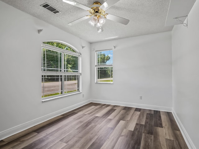 734 Port Leon Dr, Saint Marks, FL 32355 - empty room featuring a textured ceiling, wood finished floors, and ceiling fan