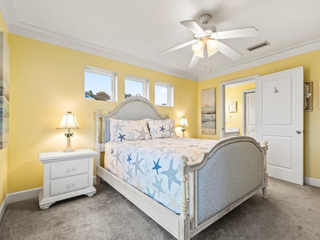 bedroom with dark colored carpet, ceiling fan, and ornamental molding