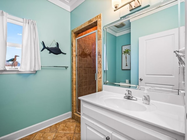 bathroom with crown molding, tile patterned flooring, vanity, and walk in shower