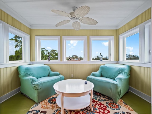 sunroom featuring ceiling fan