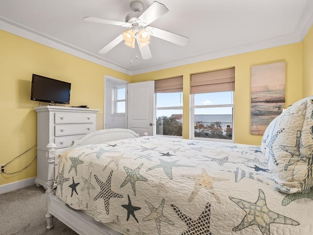 bedroom with ceiling fan, carpet floors, and ornamental molding