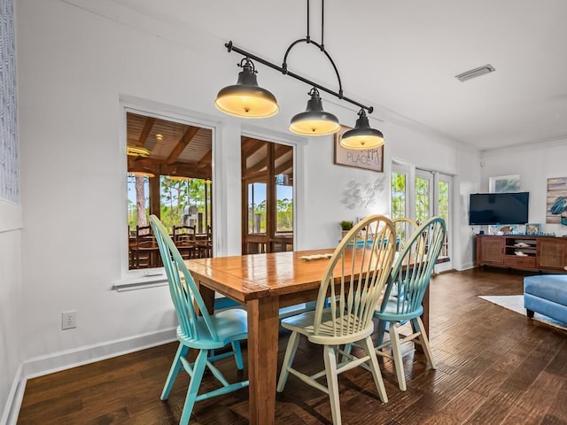 dining space with french doors and dark wood-type flooring