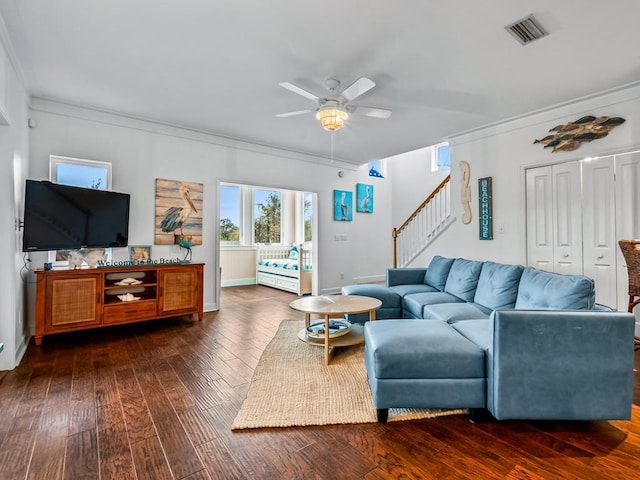 living room with ceiling fan, dark hardwood / wood-style floors, and ornamental molding