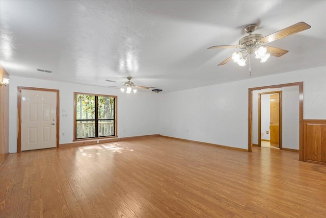 unfurnished living room featuring ceiling fan and light wood-type flooring