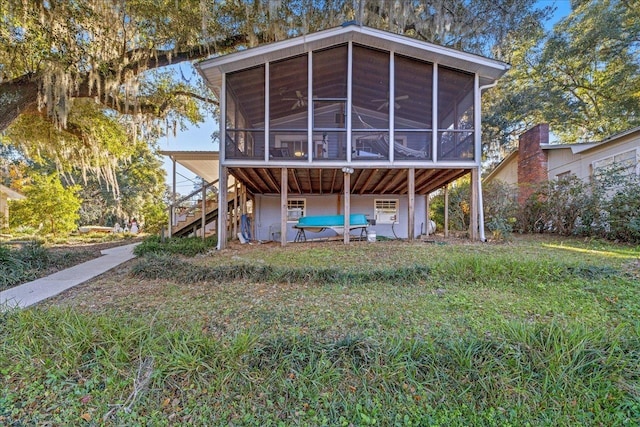 rear view of house with a sunroom