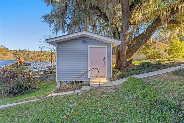 view of outbuilding featuring a yard